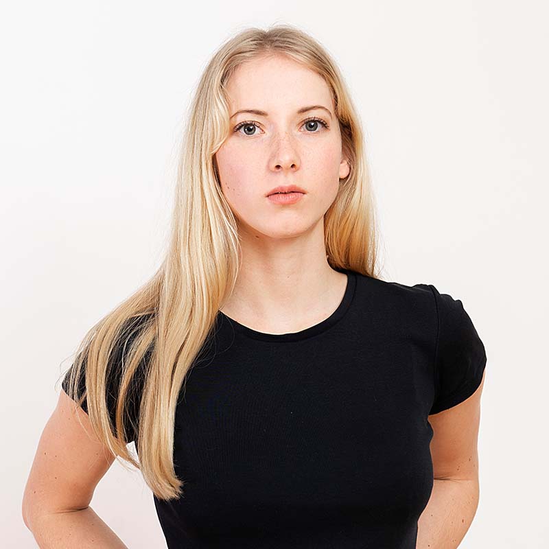 portrait of a young blonde woman isolated on a whi XQMA6UZ